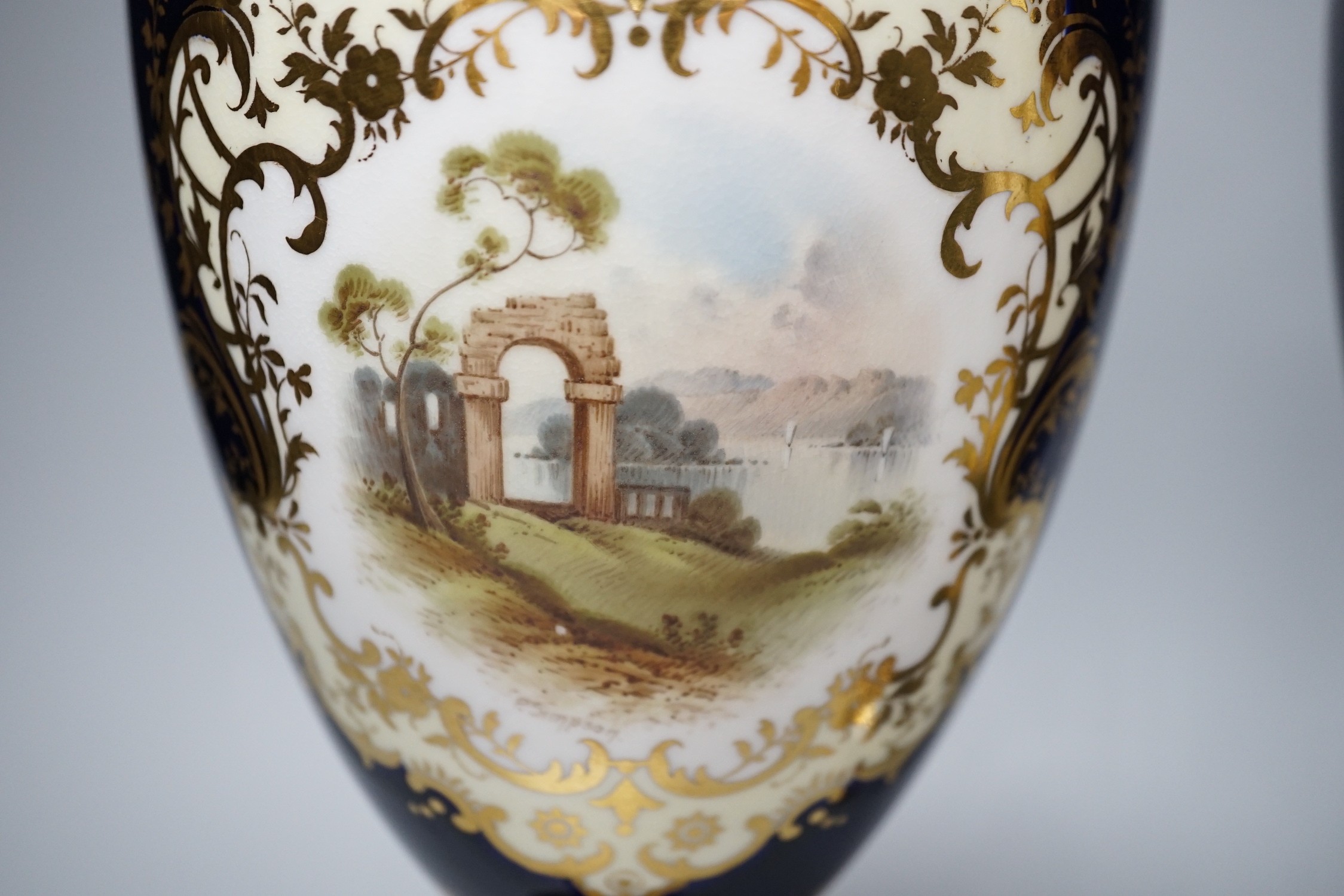 A pair of Coalport vases painted with Loch scenes by Percy Simpson, signed, 32cm